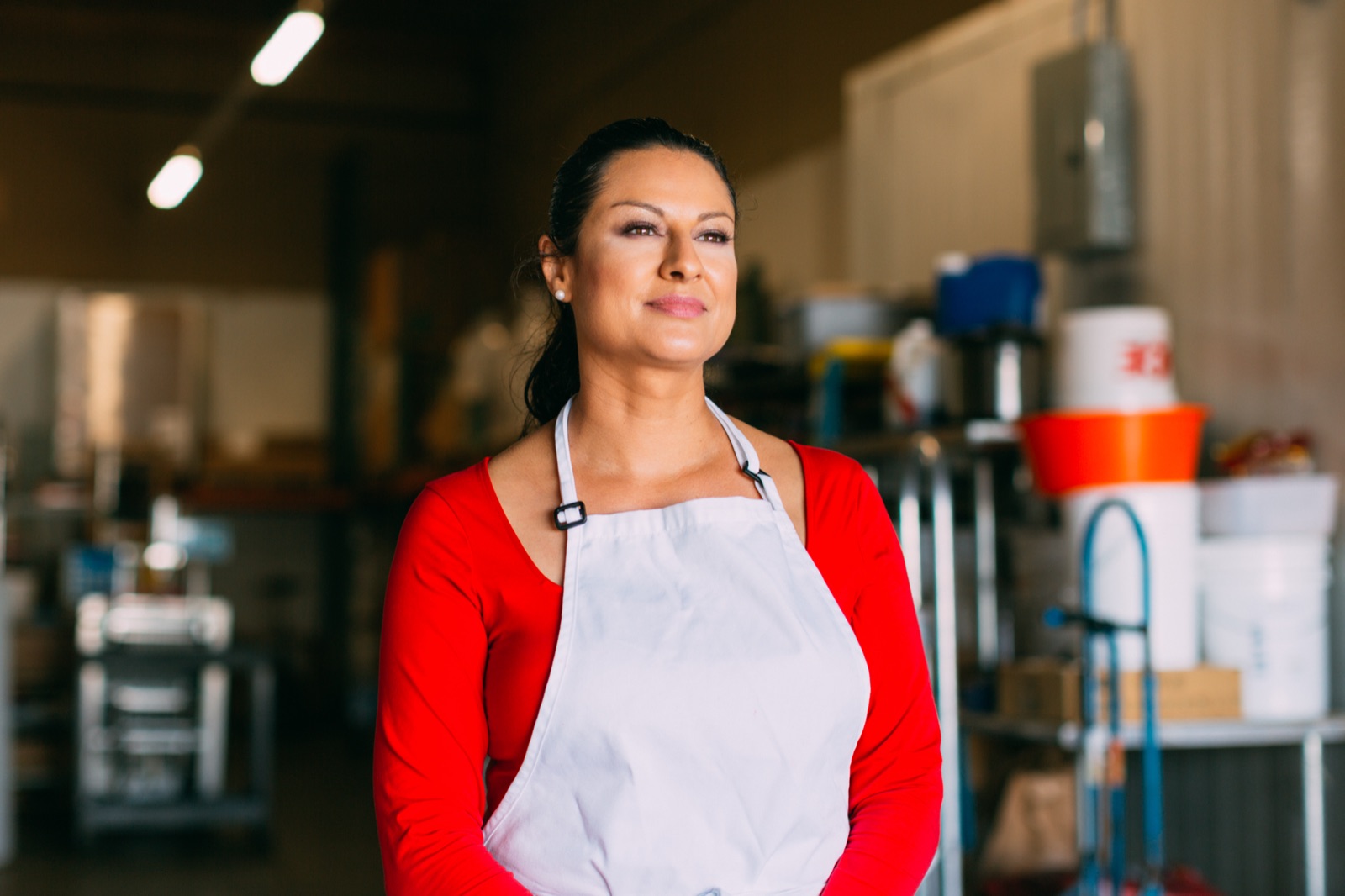 The owner of Pepito's Paletas stands in her production kitchen, looking toward the day ahead